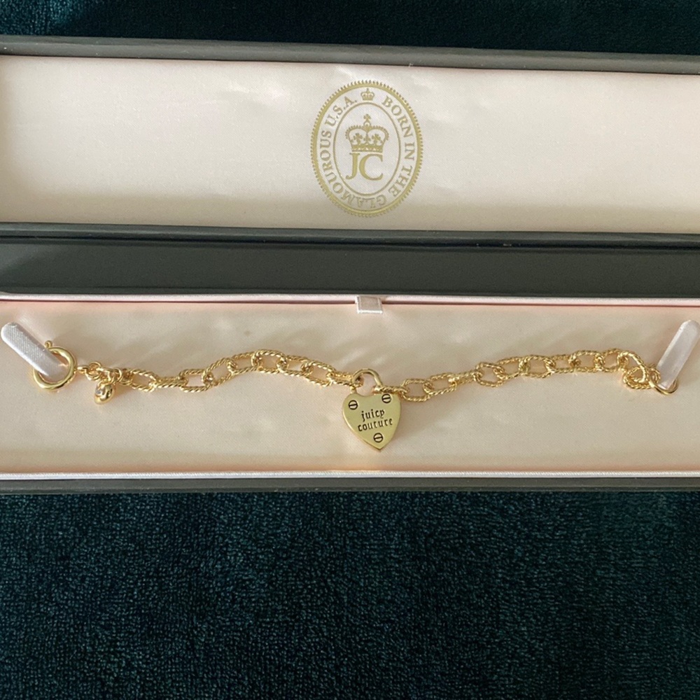Juicy couture bracelet (painted metal) new with no tags. Never been worn.